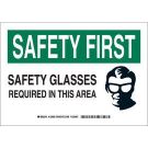 SAFETY FIRST Safety Glasses Required In This Area Sign - Self-sticking Polyester - Black/Green on White - 7 x 10