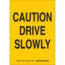 Caution Drive Slowly Sign - Self-sticking Polyester 14 x 10 - Black on Yellow
