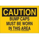 CAUTION Bump Caps Must Be Worn In This Area Sign - Self-sticking Polyester - Black on Yellow - 7 x 10